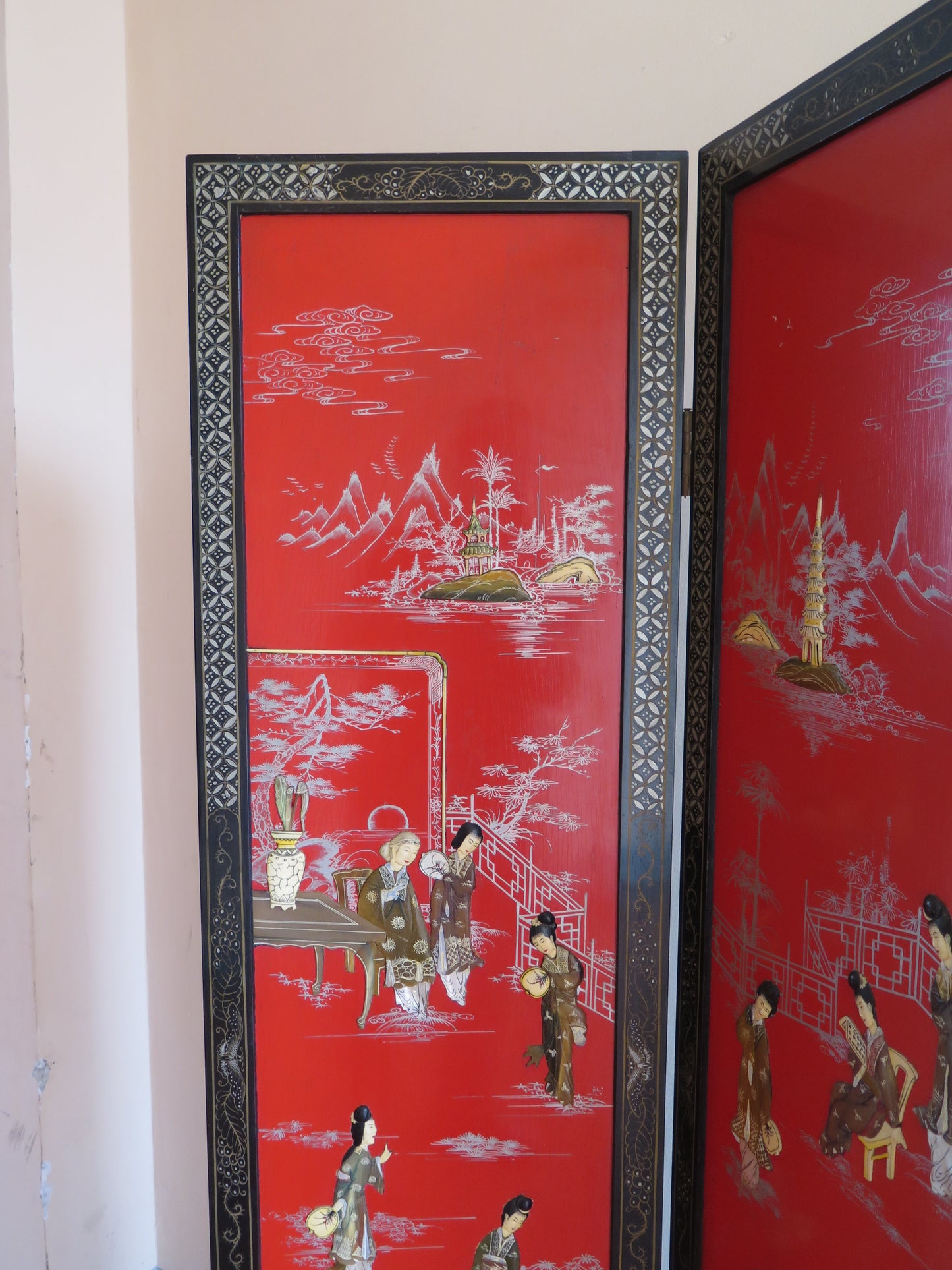 Vintage red lacquered Chinese room divider screen with inlaid wood figures