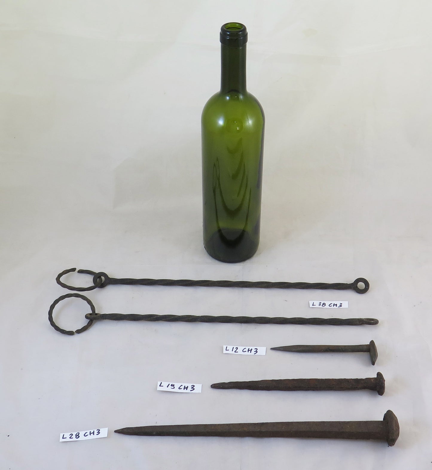 THREE LARGE WROUGHT IRON NAILS WITH TWO RODS FOR HANGING OBJECTS CH3